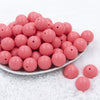 Front view of a pile of 20mm Punch Pink Matte Solid Bubblegum Beads