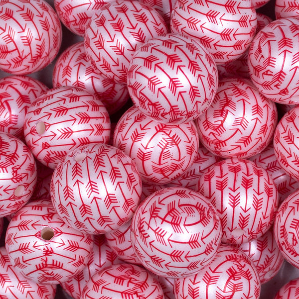 Close up view of a pile of 20mm Red Arrows Print on Matte White Bubblegum Beads