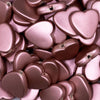 Close up view of a pile of 20mm Rose Matte Rubberized Style Heart Beads