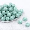 Front view of a pile of 20mm Mint Green Chevron Print Bubblegum Beads