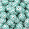 Close up view of a pile of 20mm Mint Green Chevron Print Bubblegum Beads
