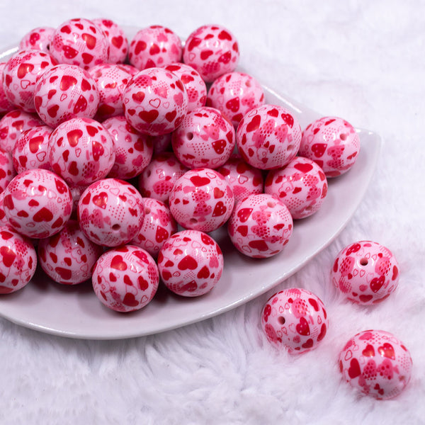 Front view of a pile of 20mm Red Hearts on Pink opaque Acrylic Bubblegum Beads