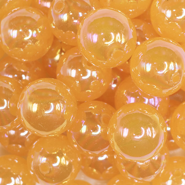 close up view of a pile of 20mm Mustard Orange Jelly AB Acrylic Chunky Bubblegum Beads