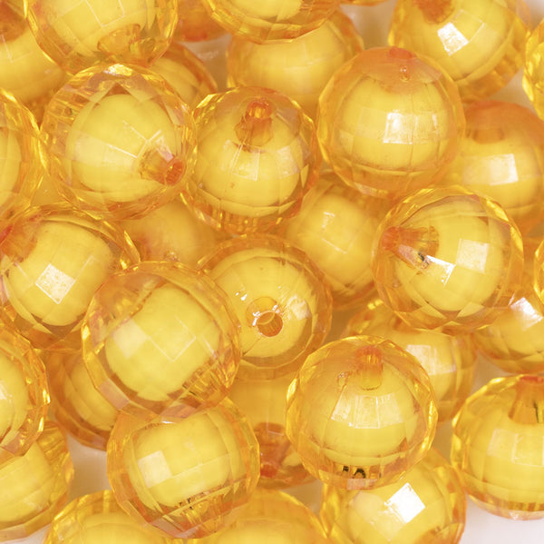 close up view of a pile of 20mm Mustard Yellow Translucent Faceted Bead in a bead Bubblegum Bead