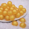 front view of a pile of 20mm Mustard Yellow Frosted Bubblegum Beads