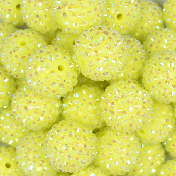 Close up view of a pile of 20mm Neon Yellow Rhinestone AB Bubblegum Beads