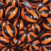 close up view of a pile of 20mm Orange with Black Stripe Beach Ball Bubblegum Beads