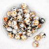 top view of a pile of 20mm Orange & Black Splatter Chunky Acrylic Bubblegum Beads