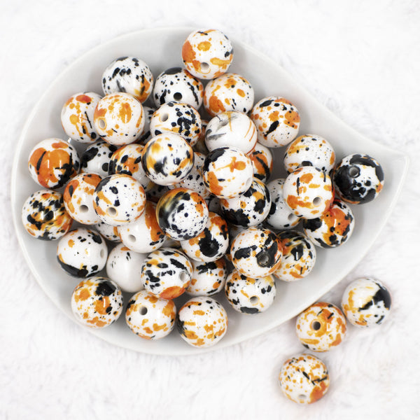 top view of a pile of 20mm Orange & Black Splatter Chunky Acrylic Bubblegum Beads