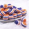 front view of a pile of 20mm Orange and Purple Stripes Bubblegum Jewelry Beads