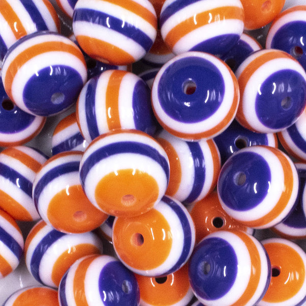 close up view of a pile of 20mm Orange and Purple Stripes Bubblegum Jewelry Beads