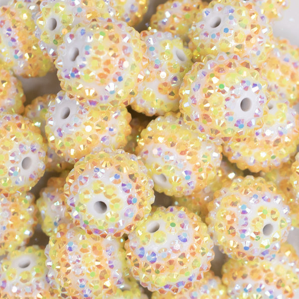 close up view of a pile of 20mm Orange and Yellow Striped Rhinestone Bubblegum Beads