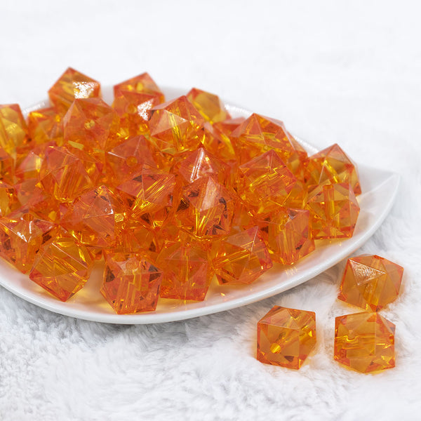Front view of a pile of 20mm Orange Transparent Cube Faceted Pearl Bubblegum Beads