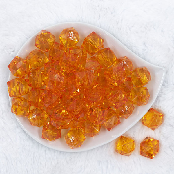 Top view of a pile of 20mm Orange Transparent Cube Faceted Pearl Bubblegum Beads