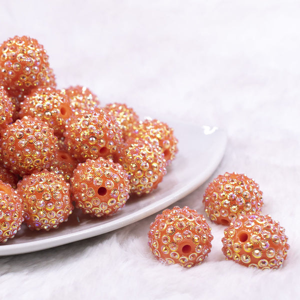 Front view of a pile of 20mm Orange Flower Rhinestone Bubblegum Beads