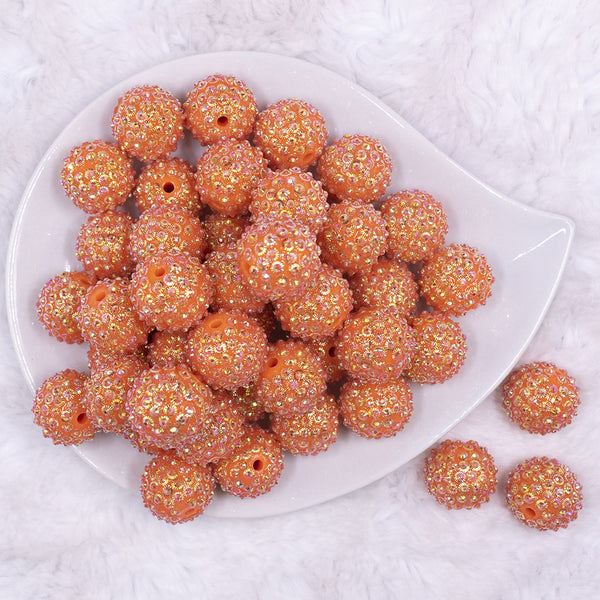 Top view of a pile of 20mm Orange Flower Rhinestone Bubblegum Beads