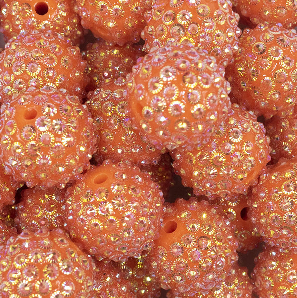 Close up view of a pile of 20mm Orange Flower Rhinestone Bubblegum Beads