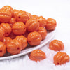 front view of a pile of 20mm Orange Opaque Pumpkin Shaped Bubblegum Bead