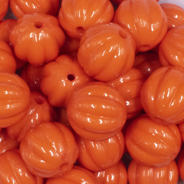 close up view of a pile of 20mm Orange Opaque Pumpkin Shaped Bubblegum Bead