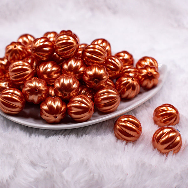 Front view of a pile of 20mm Orange Pearl Pumpkin Shaped Bubblegum Bead