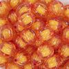 Close up view of a pile of 20mm Orange Transparent Pumpkin Shaped Bubblegum Bead