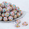 Front image of a pile of 20mm Pink, Blue, Gold Confetti Rhinestone AB Bubblegum Beads