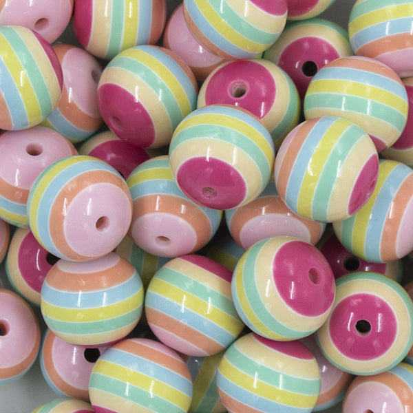 Close up view of a pile of 20mm Pastel Rainbow Striped Chunky Bubblegum Beads
