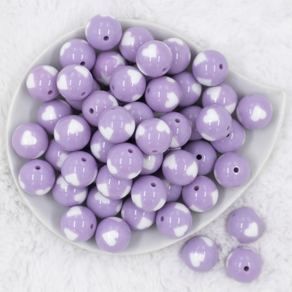 Top view of a pile of 20mm Periwinkle Purple with White Hearts Bubblegum Beads