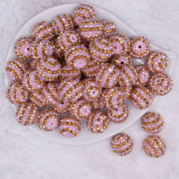 top view of a pile of 20mm Pink and Gold Striped Rhinestone AB Bubblegum Beads
