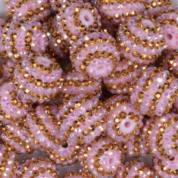 close up view of a pile of 20mm Pink and Gold Striped Rhinestone AB Bubblegum Beads