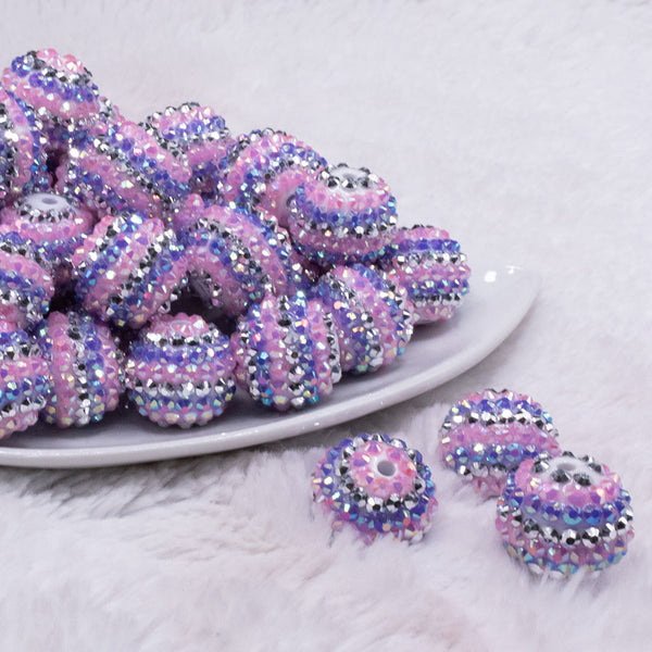 front view of a pile of 20mm Pink, Purple and Silver Striped Rhinestone AB Bubblegum Beads