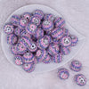 top view of a pile of 20mm Pink, Purple and Silver Striped Rhinestone AB Bubblegum Beads