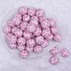 top view of a pile of 20mm White and Pink Cow Print Bubblegum Beads