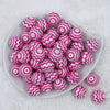 Top view of a pile of 20mm Hot Pink with Matte White Chevron Bubblegum Beads