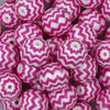 Close up view of a pile of 20mm Hot Pink with Matte White Chevron Bubblegum Beads