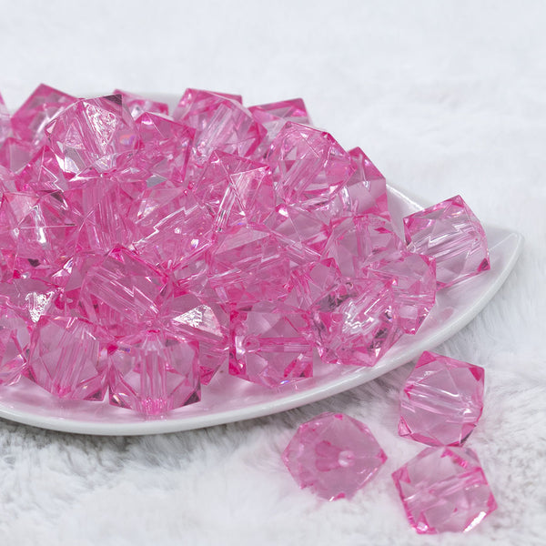 Front view of a pile of 20mm Pink Transparent Cube Faceted Pearl Bubblegum Beads