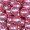Close up view of a pile of 20mm Pink with Glitter Faux Pearl Bubblegum Beads