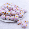 Front view of a pile of 20mm Pink & Gold Polka Dots Bubblegum Beads