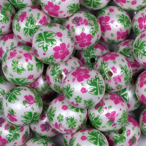Close up view of a pile of 20mm Pink & Green Hawaiian Print Flowers Bubblegum Beads