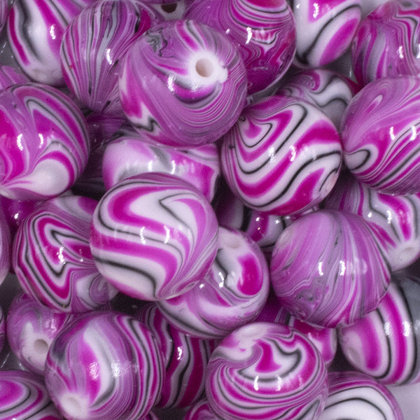 close up view of a pile of 20mm Pink Marbled Bubblegum Beads