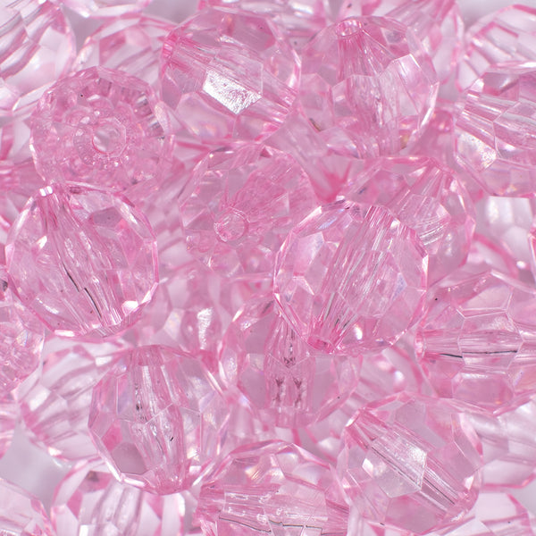 close up view of a pile of 20mm Pink Transparent Faceted Bubblegum Beads