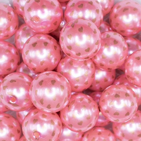 close up view of a pile of 20mm Pink with Gold Confetti Hearts Acrylic Bubblegum Beads