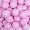 close up view of a pile of 20mm Pink with White Marble Flower Bubblegum Beads