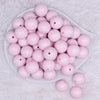 top view of a pile of 20mm White Confetti Hearts on pink opaque shine Acrylic Bubblegum Beads