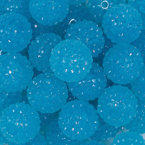 Close up view of a pile of 20mm Pool Blue with Clear Rhinestone Bubblegum Beads