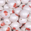 close up view of a pile of 20mm Orange Pumpkin print on Matte White Acrylic Bubblegum Beads