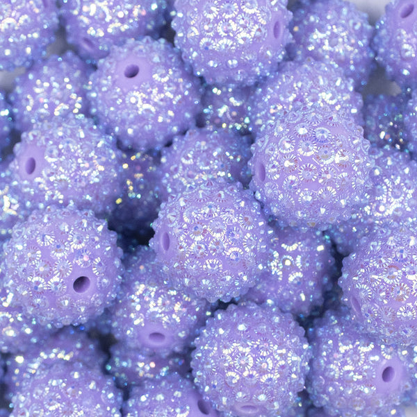 Close up view of a pile of 20mm Purple Flower Rhinestone Bubblegum Beads