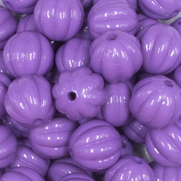 close up view of a pile of 20mm Purple Opaque Pumpkin Shaped Bubblegum Bead