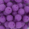 Close up view of a pile of 20mm Purple Rhinestone Bubblegum Beads