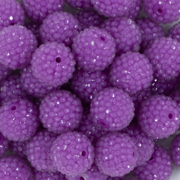 Close up view of a pile of 20mm Purple Rhinestone Bubblegum Beads